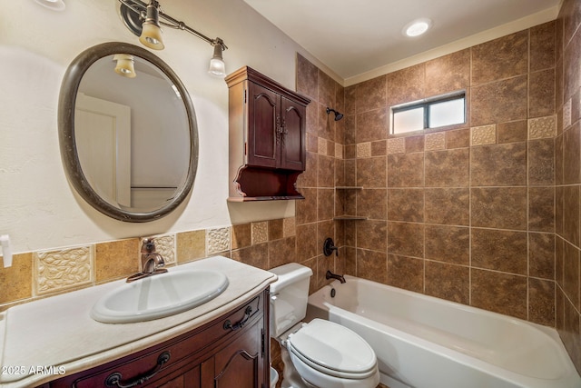 bathroom with shower / bath combination, toilet, and vanity