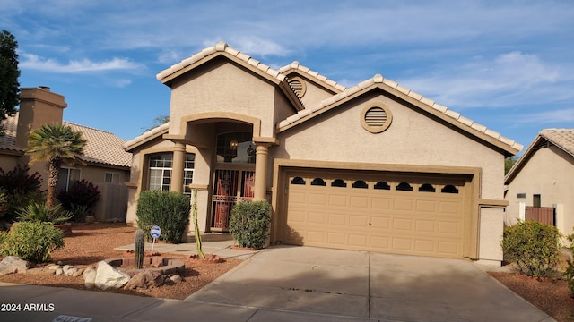 view of front of property featuring a garage