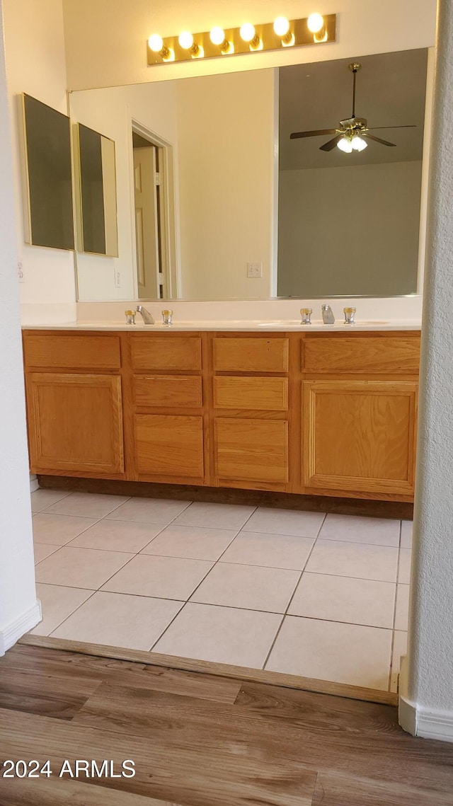 bathroom with hardwood / wood-style flooring, vanity, and ceiling fan