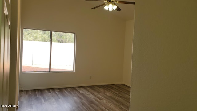 empty room featuring ceiling fan and hardwood / wood-style flooring