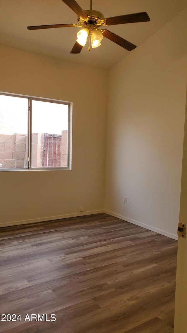 empty room with ceiling fan and wood-type flooring