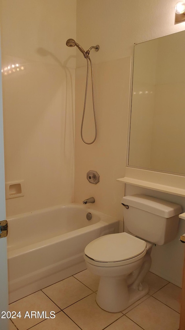 bathroom with tile patterned floors, shower / bath combination, and toilet