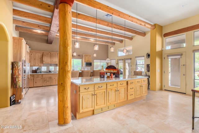 kitchen featuring beamed ceiling, plenty of natural light, backsplash, and light tile floors