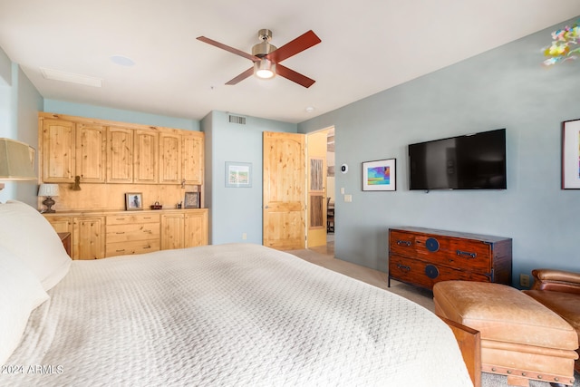 bedroom featuring ceiling fan and light colored carpet