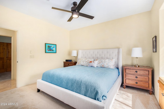 tiled bedroom with ceiling fan