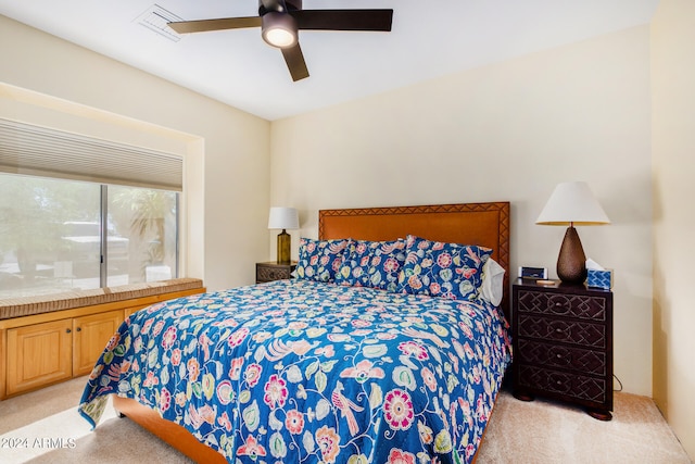 bedroom with light colored carpet and ceiling fan