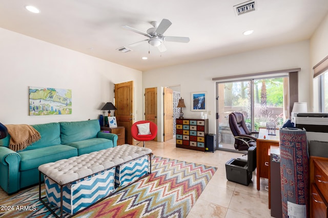 tiled living room with ceiling fan