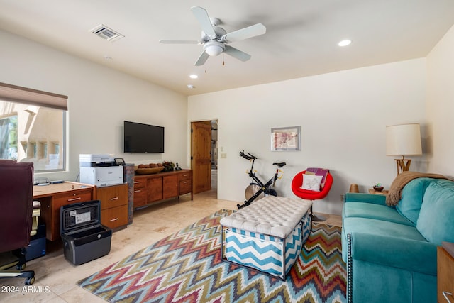 tiled living room featuring ceiling fan