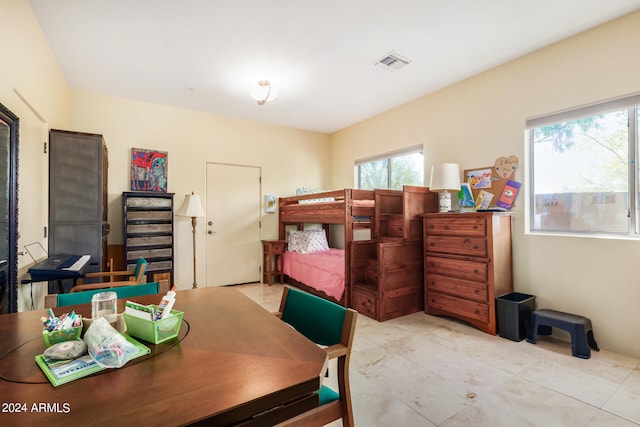 bedroom featuring light tile floors