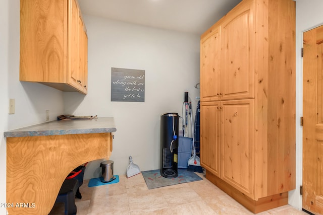 laundry room featuring light tile flooring