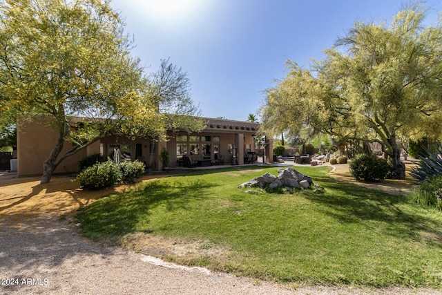 view of front of property with a front lawn