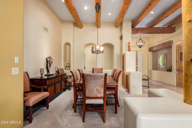 dining space featuring beamed ceiling, light colored carpet, and an inviting chandelier