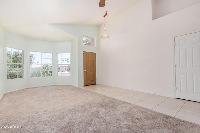786 S Catalina St, Gilbert, AZ 85233 - spare room with light colored carpet, high vaulted ceiling, and light tile patterned floors