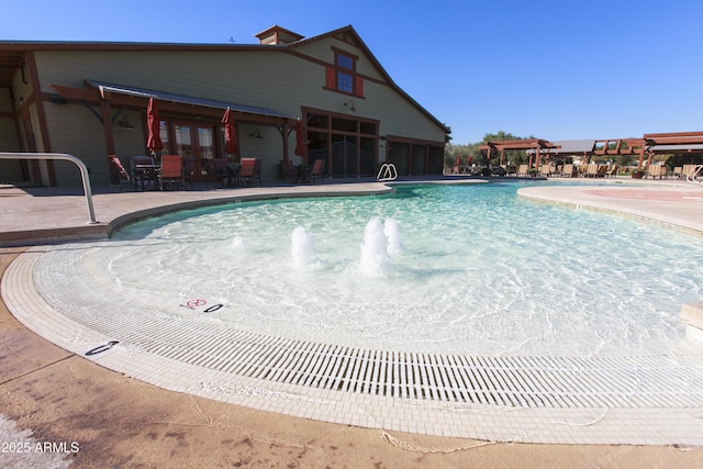 pool with a patio area