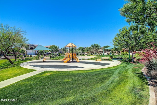 communal playground featuring a lawn