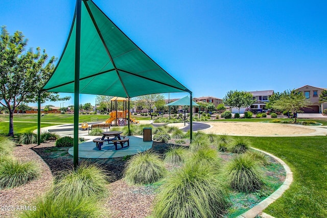 view of community with a yard and playground community