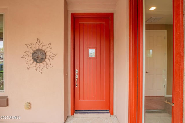 doorway to property with visible vents