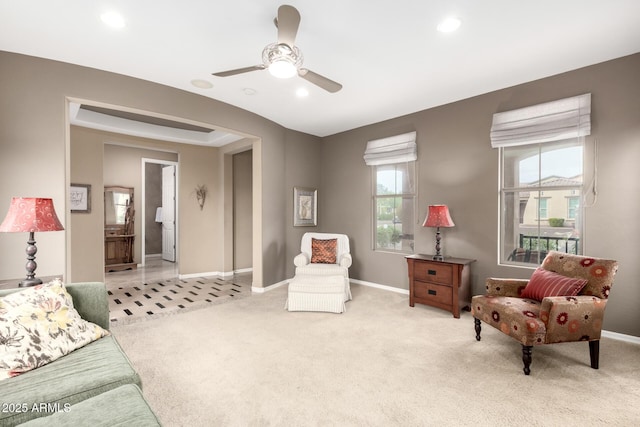 sitting room featuring recessed lighting, light colored carpet, baseboards, and ceiling fan