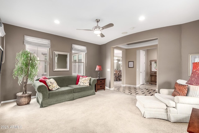 living area with recessed lighting, a ceiling fan, baseboards, and light carpet