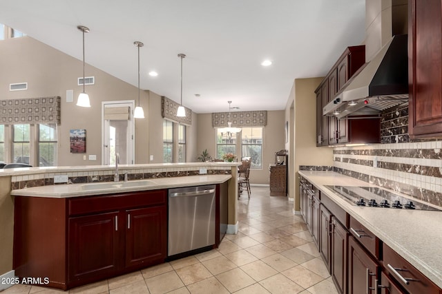 kitchen with visible vents, black electric stovetop, wall chimney range hood, dishwasher, and a sink