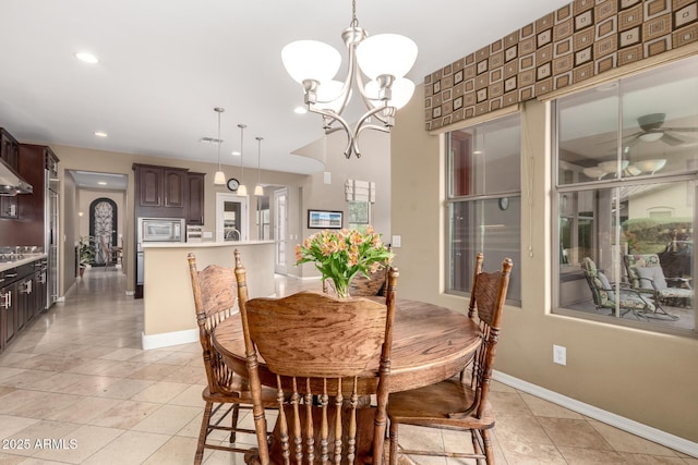 dining area featuring recessed lighting, ceiling fan with notable chandelier, baseboards, and light tile patterned floors