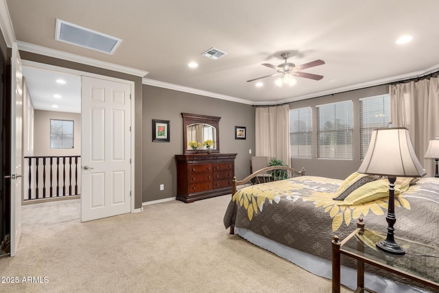 bedroom with crown molding, baseboards, visible vents, and light carpet