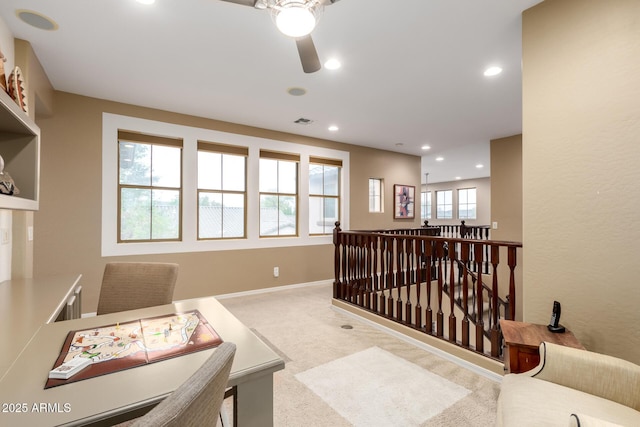 interior space featuring recessed lighting, visible vents, baseboards, and ceiling fan