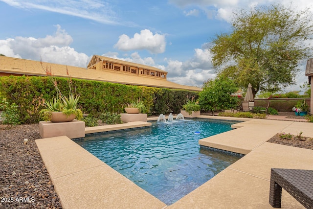 view of pool with a patio area, a fenced in pool, and fence