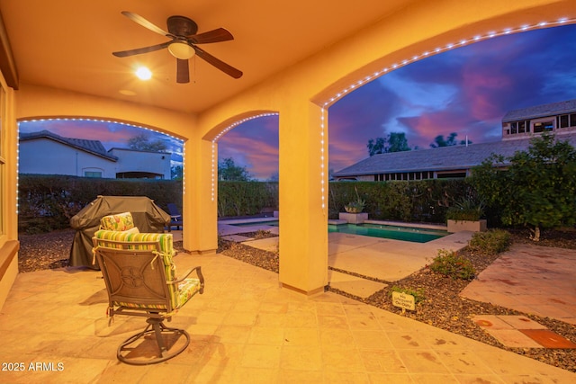 view of patio / terrace featuring grilling area, a fenced backyard, a fenced in pool, and ceiling fan