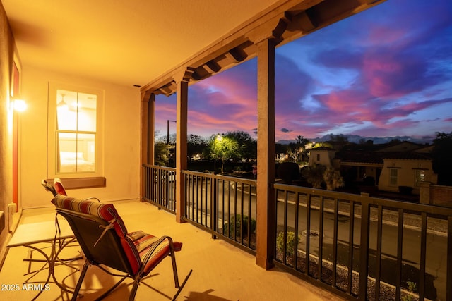 view of balcony at dusk