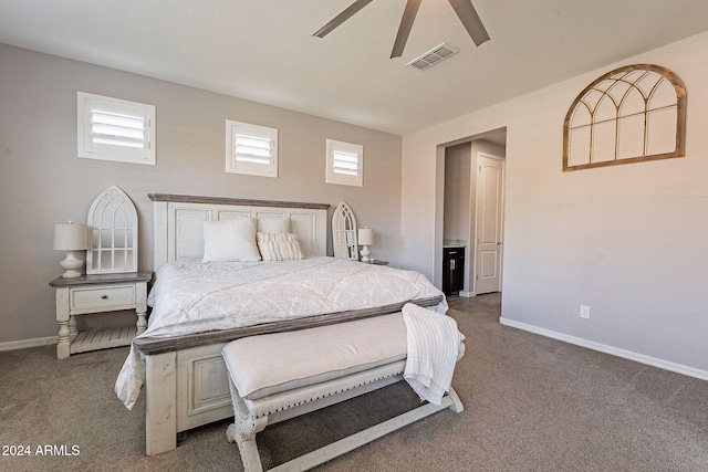 bedroom featuring carpet flooring, multiple windows, and ceiling fan