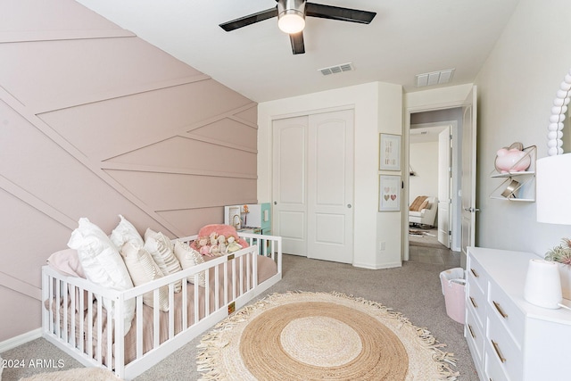 carpeted bedroom with a closet and ceiling fan