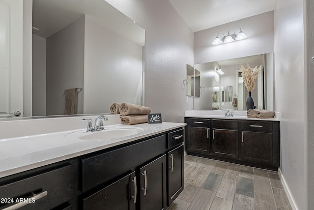 bathroom with vanity and wood-type flooring