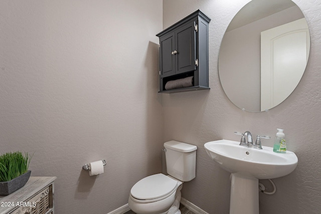 bathroom featuring toilet