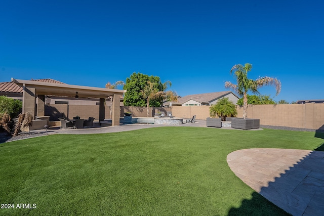 view of yard featuring a patio area and ceiling fan