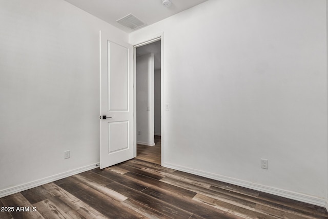 unfurnished room featuring dark hardwood / wood-style floors