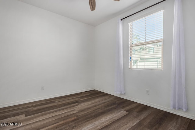 spare room with ceiling fan and dark hardwood / wood-style flooring