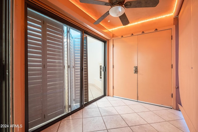 interior space featuring ceiling fan