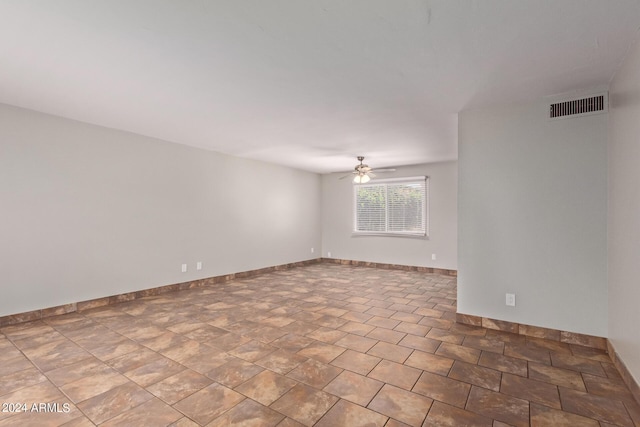 spare room with ceiling fan