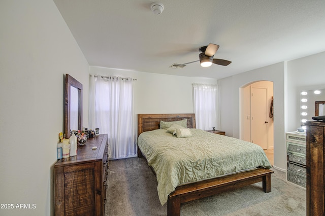 1107 E Ln Salle St, Phoenix, AZ 85040 - carpeted bedroom with arched walkways and ceiling fan