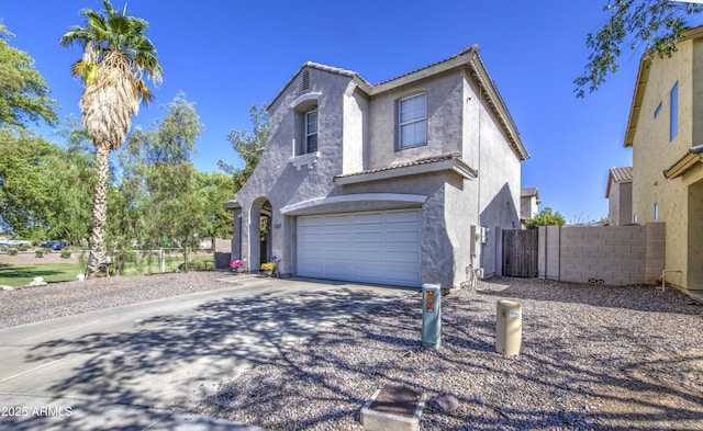 1107 E Ln Salle St, Phoenix, AZ 85040 - traditional-style house with concrete driveway, stucco siding, a garage, a tiled roof, and a gate