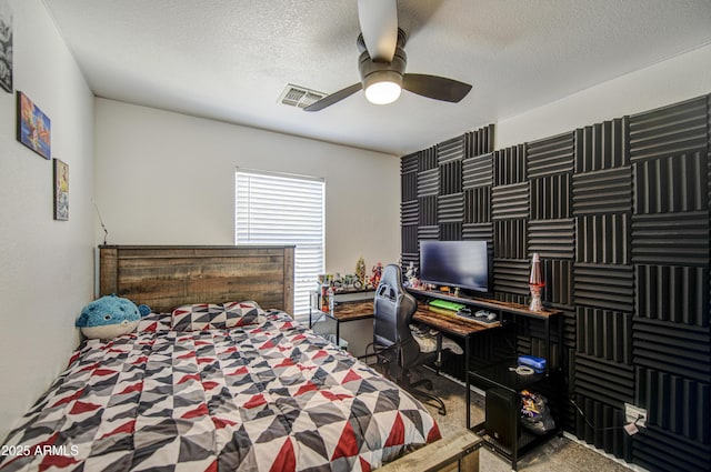 1107 E Ln Salle St, Phoenix, AZ 85040 - bedroom with a textured ceiling, an office area, carpet, and a ceiling fan