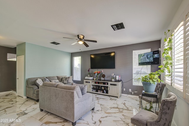 1107 E Ln Salle St, Phoenix, AZ 85040 - living area featuring plenty of natural light, ceiling fan, and light marble finish floors