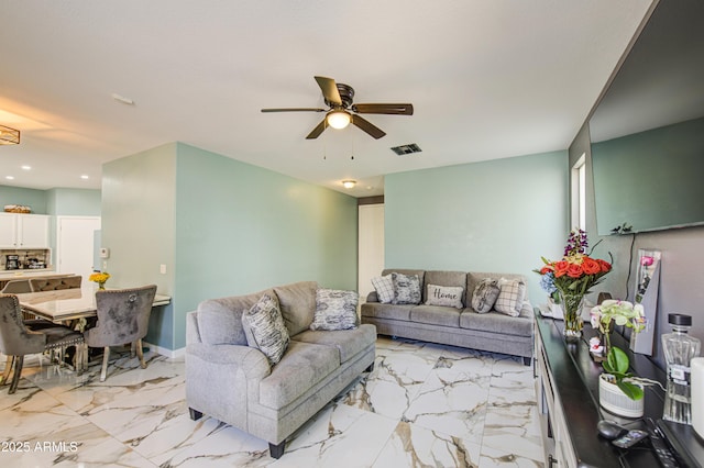 1107 E Ln Salle St, Phoenix, AZ 85040 - living room with ceiling fan, light marble finish flooring, and recessed lighting