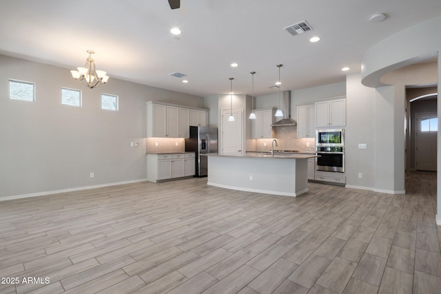 2644 S Dock St, Gilbert, AZ 85295 - kitchen featuring visible vents, open floor plan, appliances with stainless steel finishes, and wall chimney range hood
