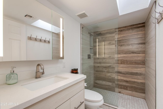 full bathroom featuring visible vents, toilet, and a walk in shower