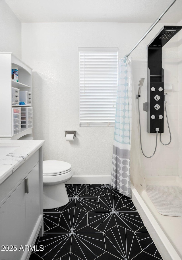 bathroom featuring a shower with curtain, toilet, and vanity