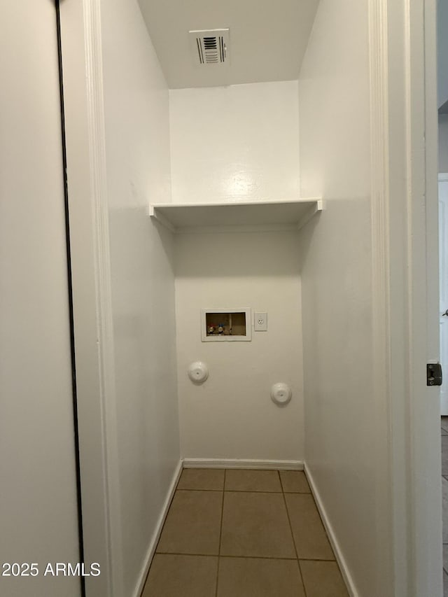 clothes washing area with laundry area, visible vents, gas dryer hookup, tile patterned floors, and washer hookup