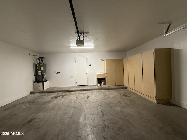 garage with electric water heater and a garage door opener