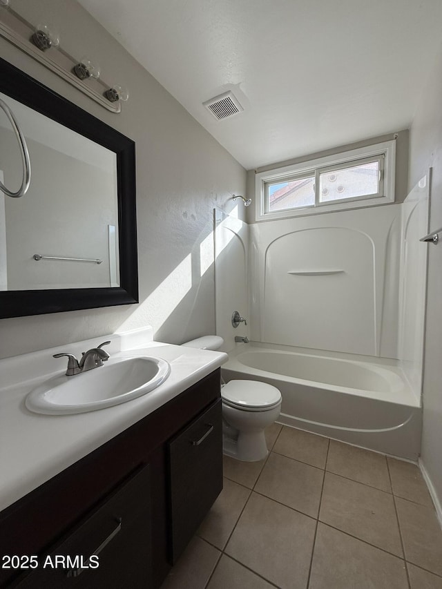 bathroom featuring visible vents, toilet, tub / shower combination, vanity, and tile patterned flooring